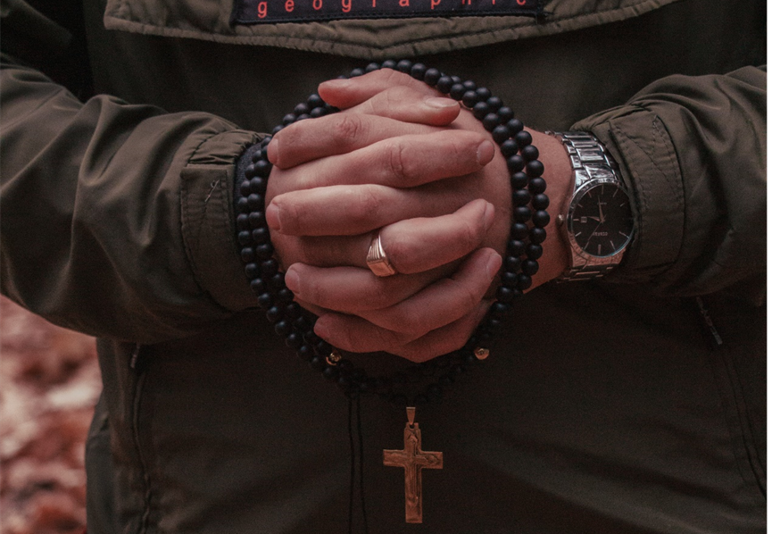 A man wearing a christian ring-Gthic.com