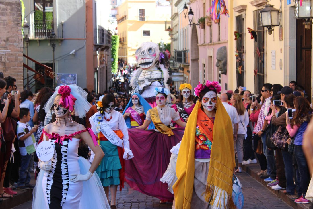 women-wearing-costumes-walking-on-a-parade