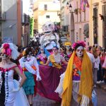 women-wearing-costumes-walking-on-a-parade