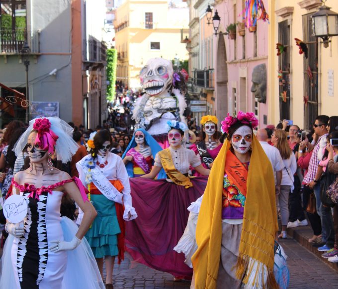 women-wearing-costumes-walking-on-a-parade