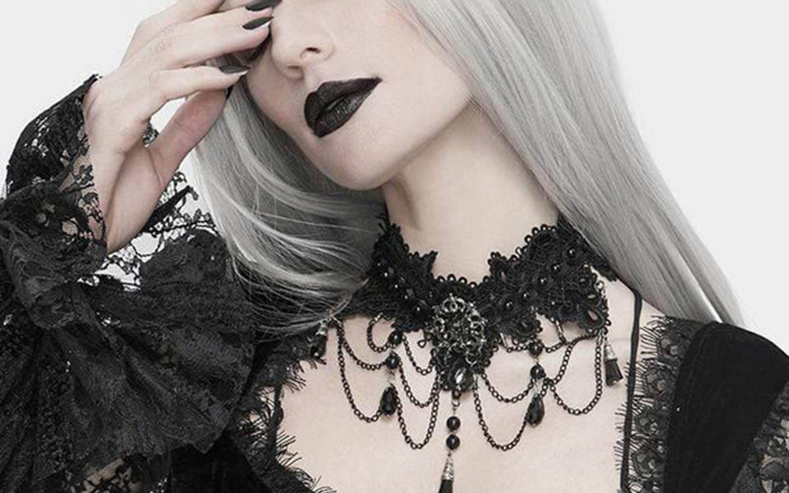 A goth woman wear a gothic choker