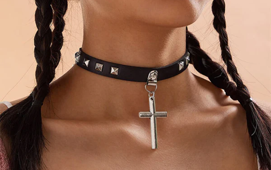 A girl wear a gothic cross choker