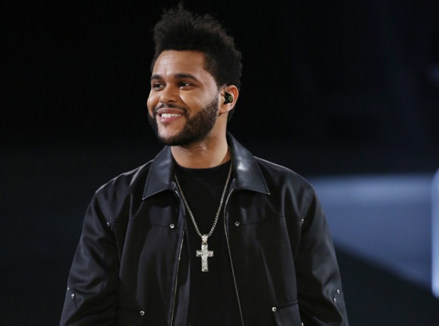 The Weeknd wear a Christian cross necklace