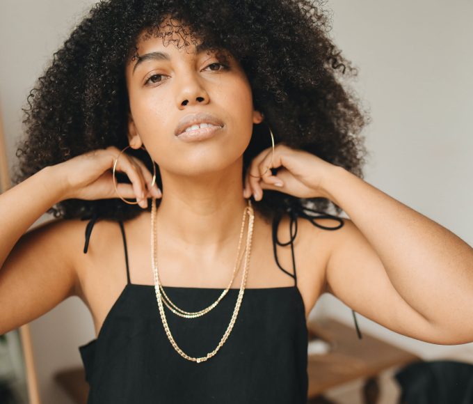 woman-in-black-spaghetti-strap-top-wearing-necklace
