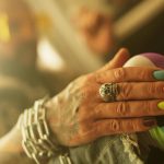 skull ring on man's hand