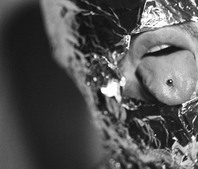 a man with tongue piercings